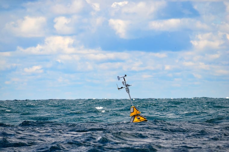 Weather buoy drifting on sea