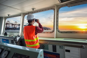 Offshore professional having overview from a ship
